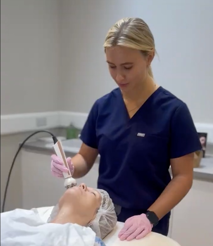 Practitioner performing a Facestim treatment